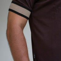 Model wearing an LCY Polo, with contrast ribbed and cuffs