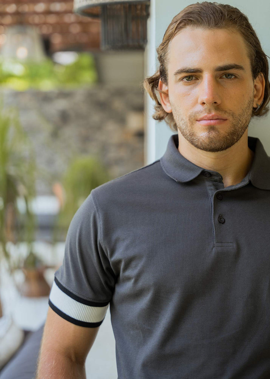 Model wearing an LCY Polo, with contrast ribbed and cuffs.